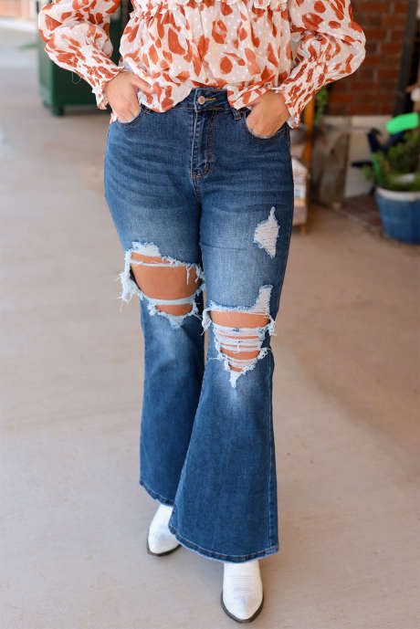 Jean évasé bleu taille haute à découpes et effet vieilli