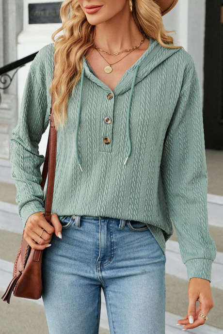 Miętowo-zielony top z kapturem i długim rękawem, zapinany na guziki z teksturowanym sznurkiem