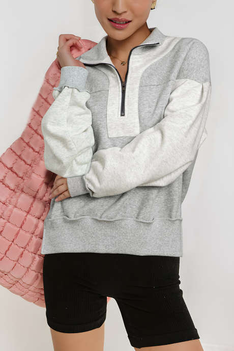 Siv pulover z zadrgo in spuščenimi stranskimi razporki