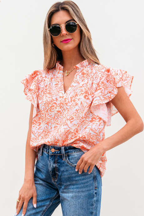 Blouse orange à manches volantées et col fendu à fleurs
