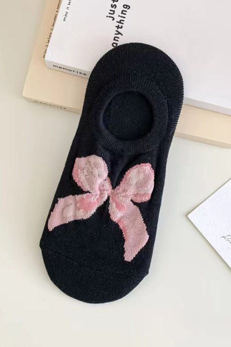 Weiche Füßlinge in Schwarz mit Schleife