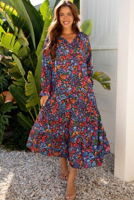 Robe longue fluide à imprimé floral bleu, col en V, manches longues et pompons