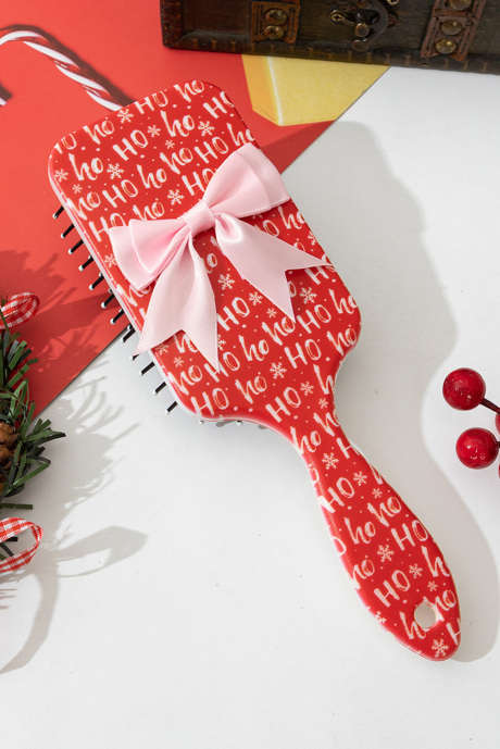 Peine para masaje del cuero cabelludo con lazo de cinta con estampado de letras navideñas en rojo intenso