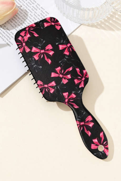 ブラックのキュートなリボンボウプリントのエアクッションコーム