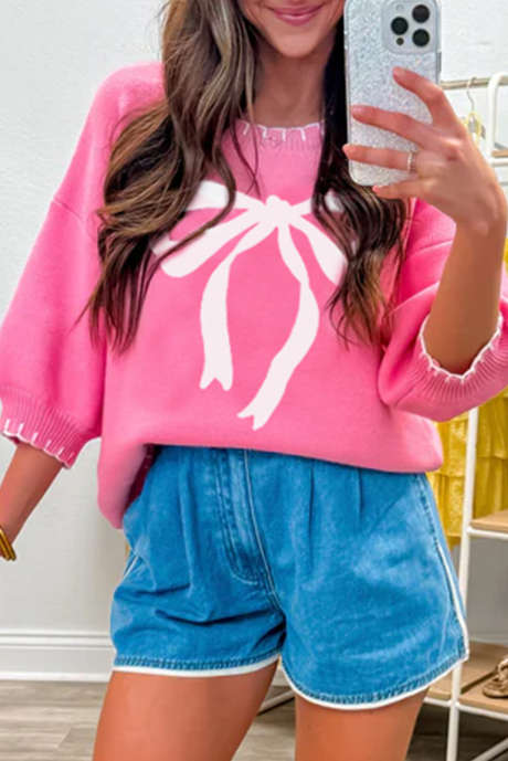 Roze trui met grote strikprint en contrasterende stiksels en verlaagde schouders