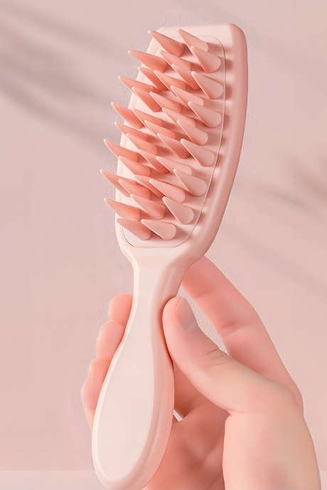 ライトピンクのシリコン製頭皮マッサージヘアブラシ