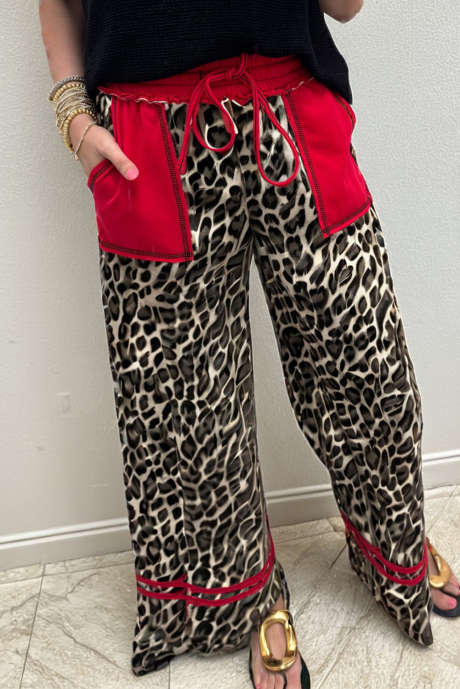 ベージュのヒョウ柄、切りっぱなしの縫い目、コントラストのパッチポケット、ドローストリング、伸縮性ウエスト、ワイドレッグパンツ