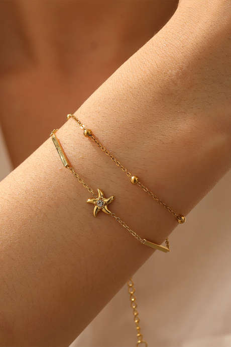 Pulseira de corrente dupla com detalhe de estrela e miçangas banhadas a ouro BH014634-P12