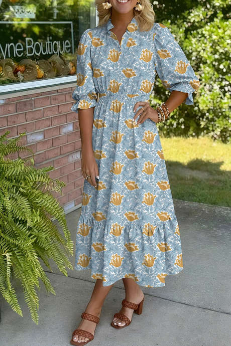 Brun blommig klänning med volanger och v-ringning och armbandsärm