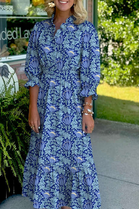 Himmelsblå blommig tryckt volangklänning med v-ringning och armbandsärm