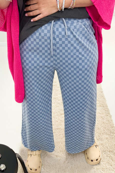 Světle modré kostkované kalhoty s elastickým pasem a stahovací šňůrkou, volné a ležérní