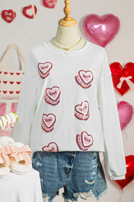 Valkoinen paljeteilla koristeltu sydänkuvioinen narullinen ystävänpäiväcollegepaita