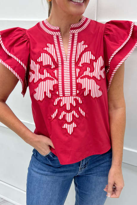 Kilpa-ajopaita raidallisella reunuksella ja kirjailtuilla hihoilla