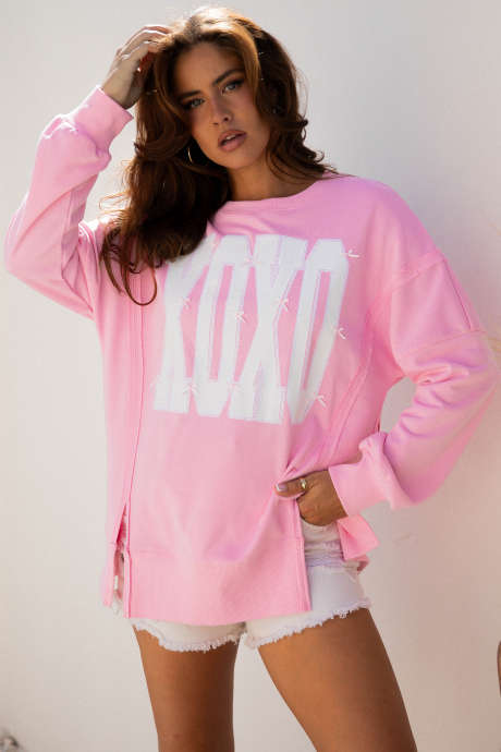 Sweat-shirt ample à coutures apparentes avec imprimé lettre XOXO et nœud rose pailleté