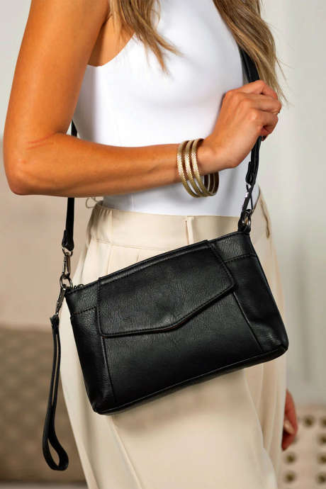 Črna torba iz umetnega usnja, ki se lahko spremeni v sklopko