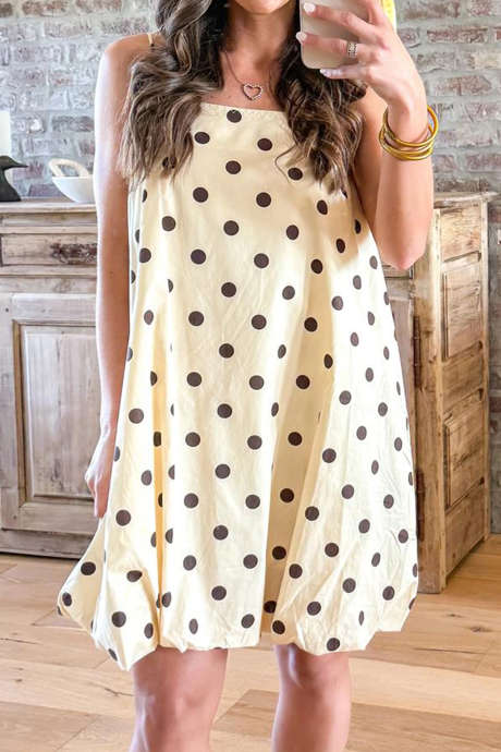 Beige crèmekleurige jurk met stippen