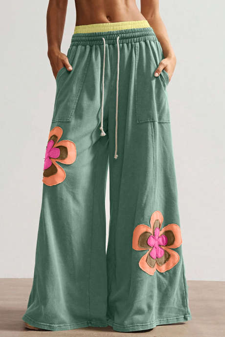 Široke hlače z elastičnim pasom v morsko zelenih barvnih blokih in cvetličnim vzorcem z vrvico