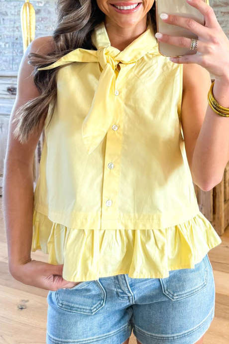 Geelcrème tanktop met zonnestralenprint en chique ruches