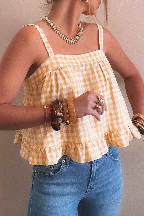 Karirasti brezrokavnik v barvi banane in kreme