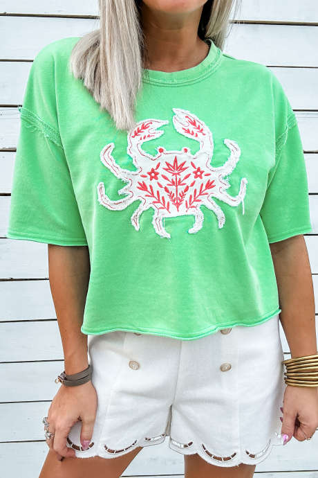 Lys grønn krabbebroderi med korte ermer og rund hals