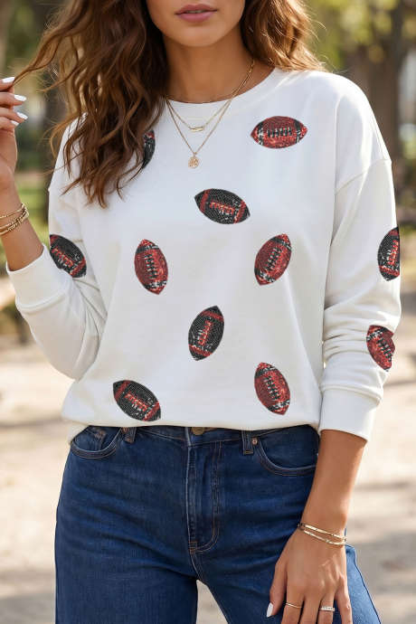 Maglia a maniche lunghe girocollo bianca con paillettes a fantasia rugby e pallone da calcio.