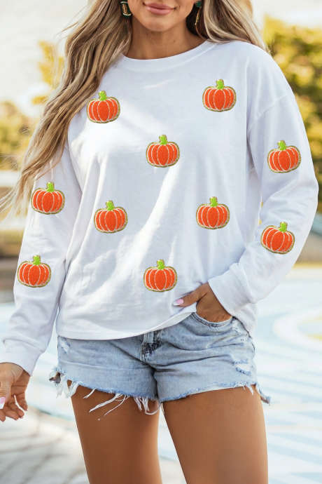 Top a maniche lunghe in ciniglia bianca glitterata con stampa a zucche