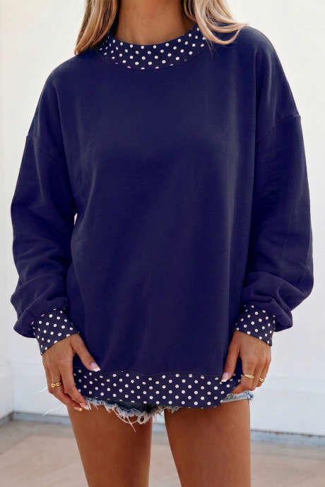 Felpa oversize blu scuro a blocchi di colore con pois e bordi a contrasto.