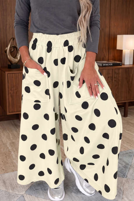 Pantalones casuales de pierna ancha con cintura elástica y estampado de lunares beige.