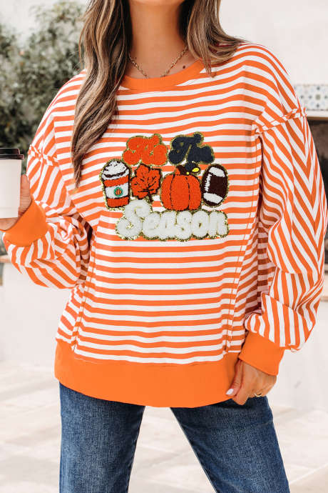 Oranje gestreepte top met herfstthema en pompoenmotief, lange mouwen