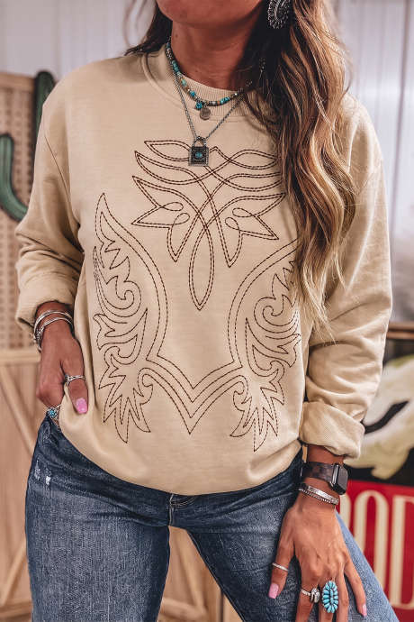Sudadera de manga larga con cuello redondo y bordado estilo western en color beige claro francés.