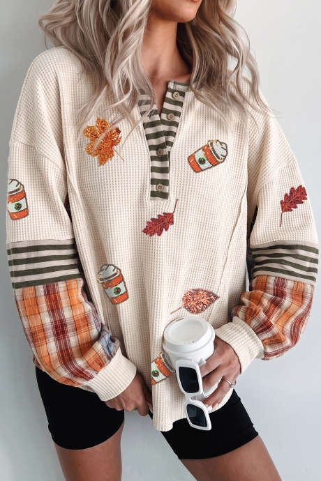 Beige top met pailletten en een herfstachtig patroon van ruitjes en strepen, patchwork wafelstructuur.