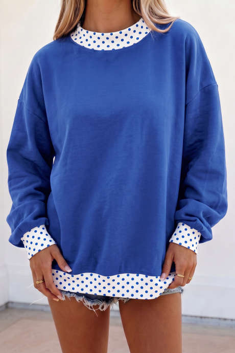 Donkerblauwe oversized sweater met kleurblokken en stippen, contrasterende bies