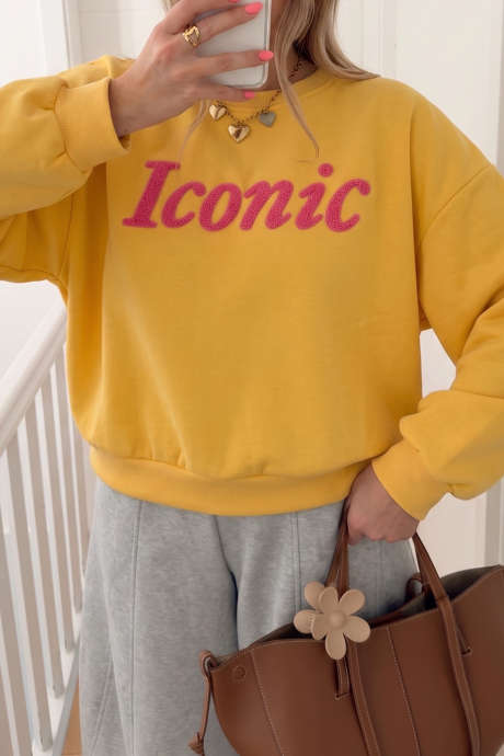 Gul ikonisk sweatshirt med rund hals og fuzzy bogstaver