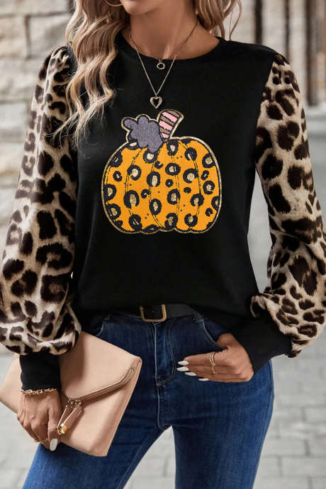 Khaki gebreide top met luipaardprint op de mouwen en pompoenmotief.