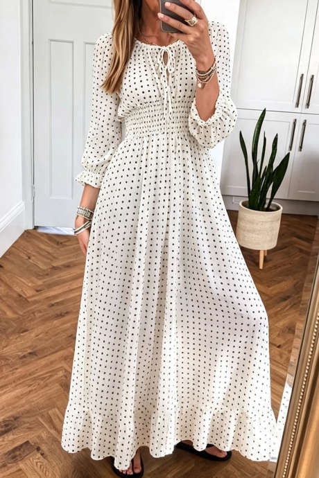Vestido longo de manga comprida com estampa de bolinhas brancas e cintura marcada