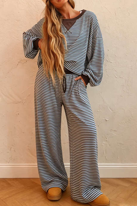 Conjunto de dos piezas: top holgado con hombros caídos y pantalón a rayas marrones.