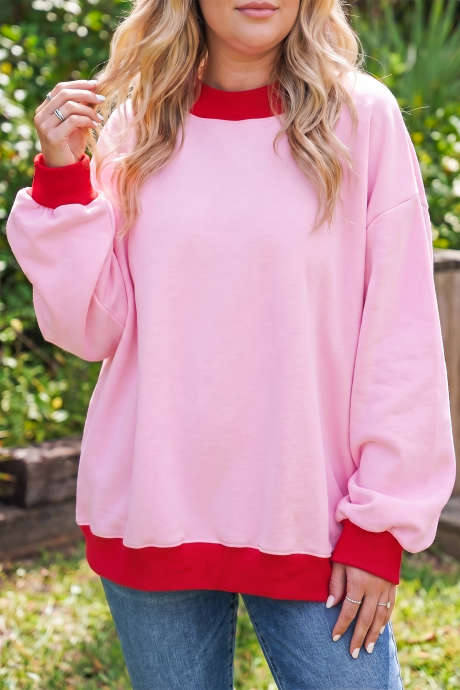 Pinkfarbenes Sweatshirt in Übergröße mit kontrastierenden Ziernähten und Farbblockmuster