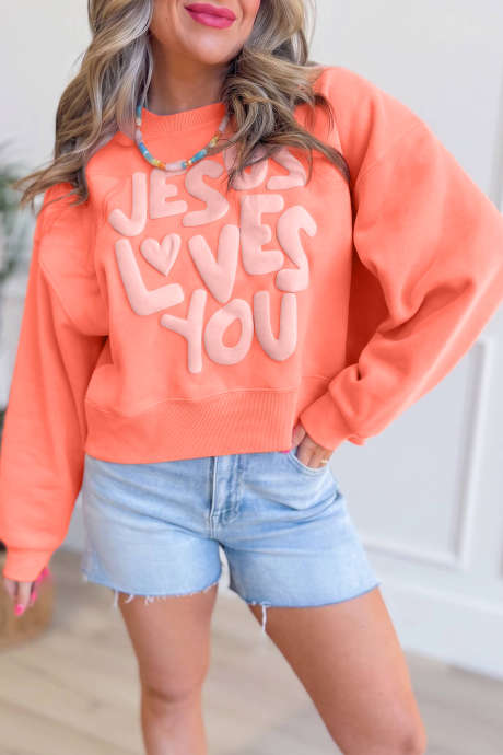 Sweat-shirt à inscription en relief «&nbsp;Jésus t'aime&nbsp;» pamplemousse orange