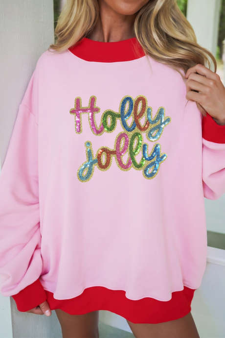 Sudadera rosa con lentejuelas y eslogan navideño "Holly jolly" con cuello alto y ribete de bloques de color.