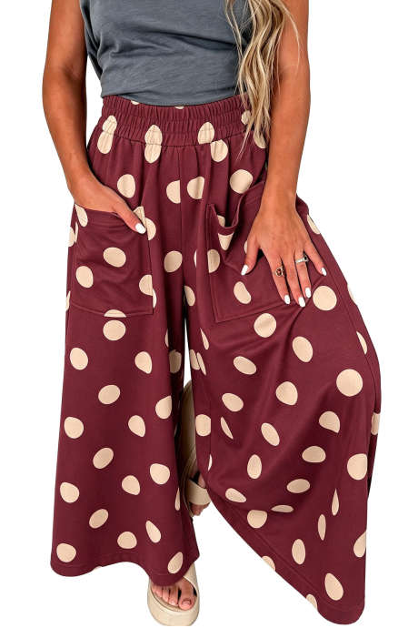Pantalones casuales de pierna ancha con cintura elástica y estampado de lunares burdeos.